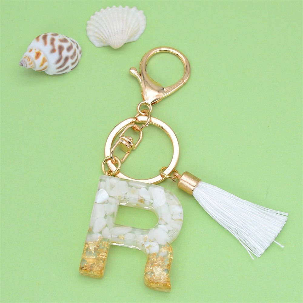 White Stone/Gold Flakes Letter Resin Keyring With White Tassel | Bag Accessory